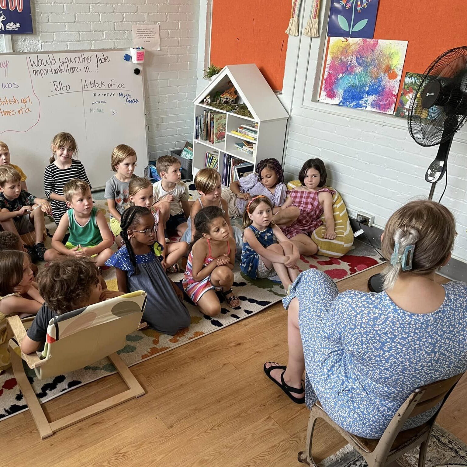 Kindergarten students read a book.