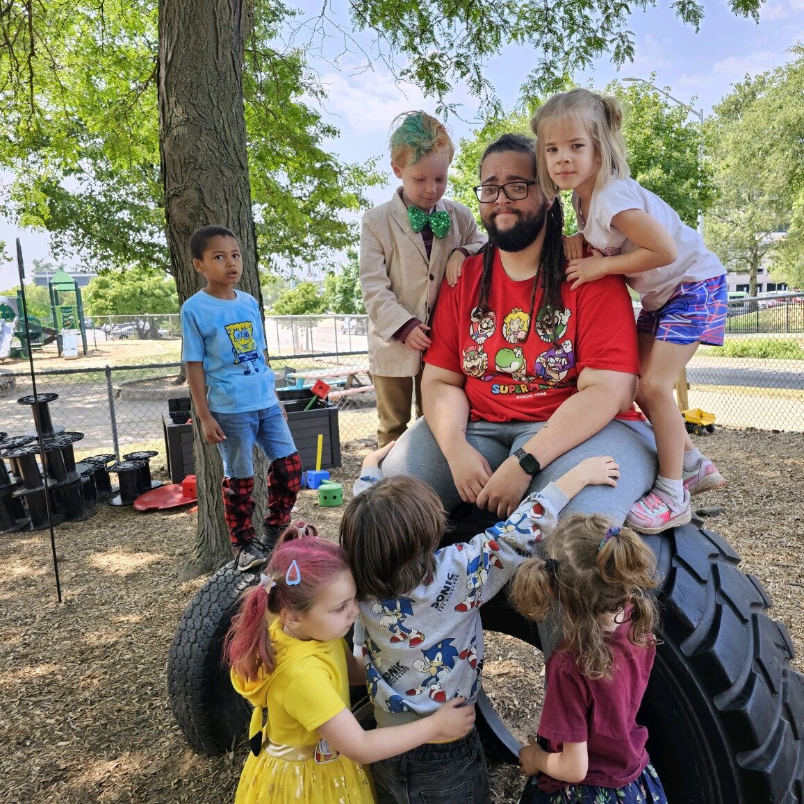 Discovery Care student climb atop their teacher.